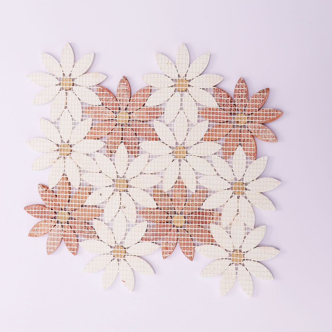 Back view of red and white flower marble mosaic tile with mesh backing.