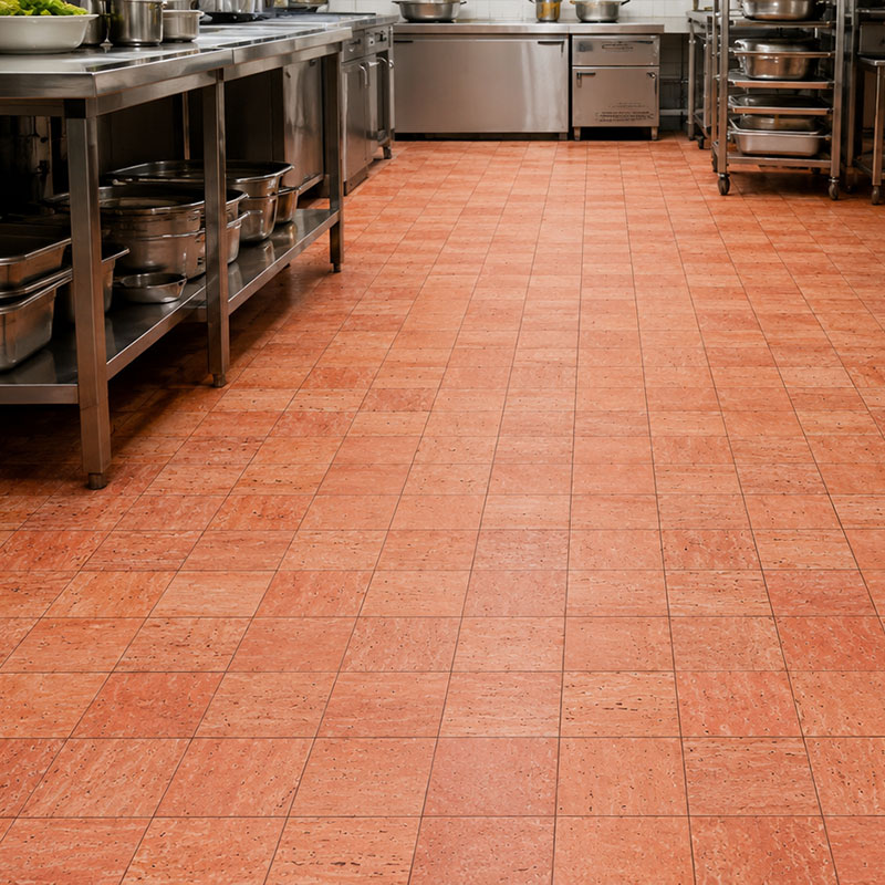 Red stone floor tiles in a busy commercial restaurant kitchen