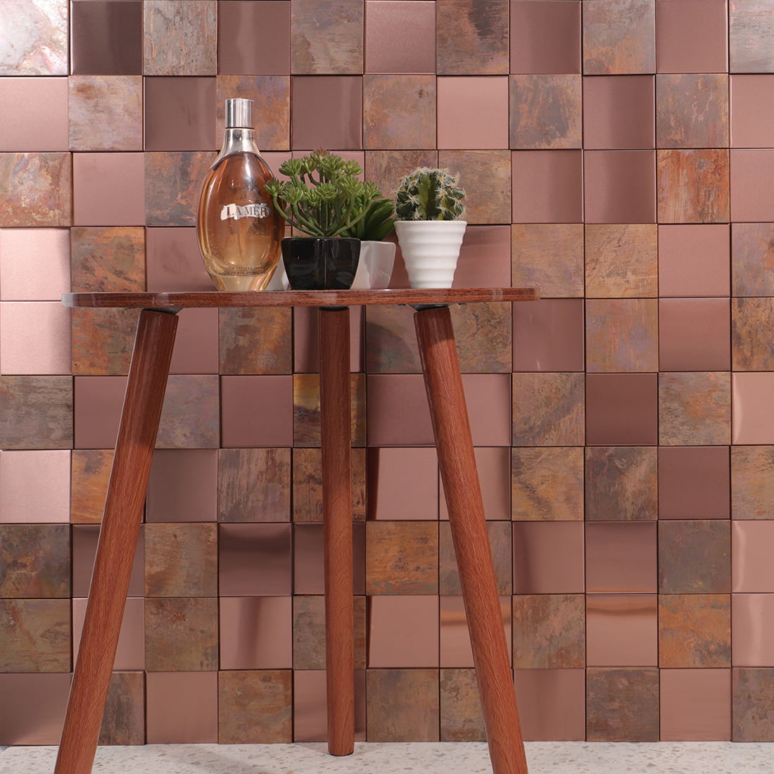 Rose gold and antique copper square metal mosaic wall in styled decor scene