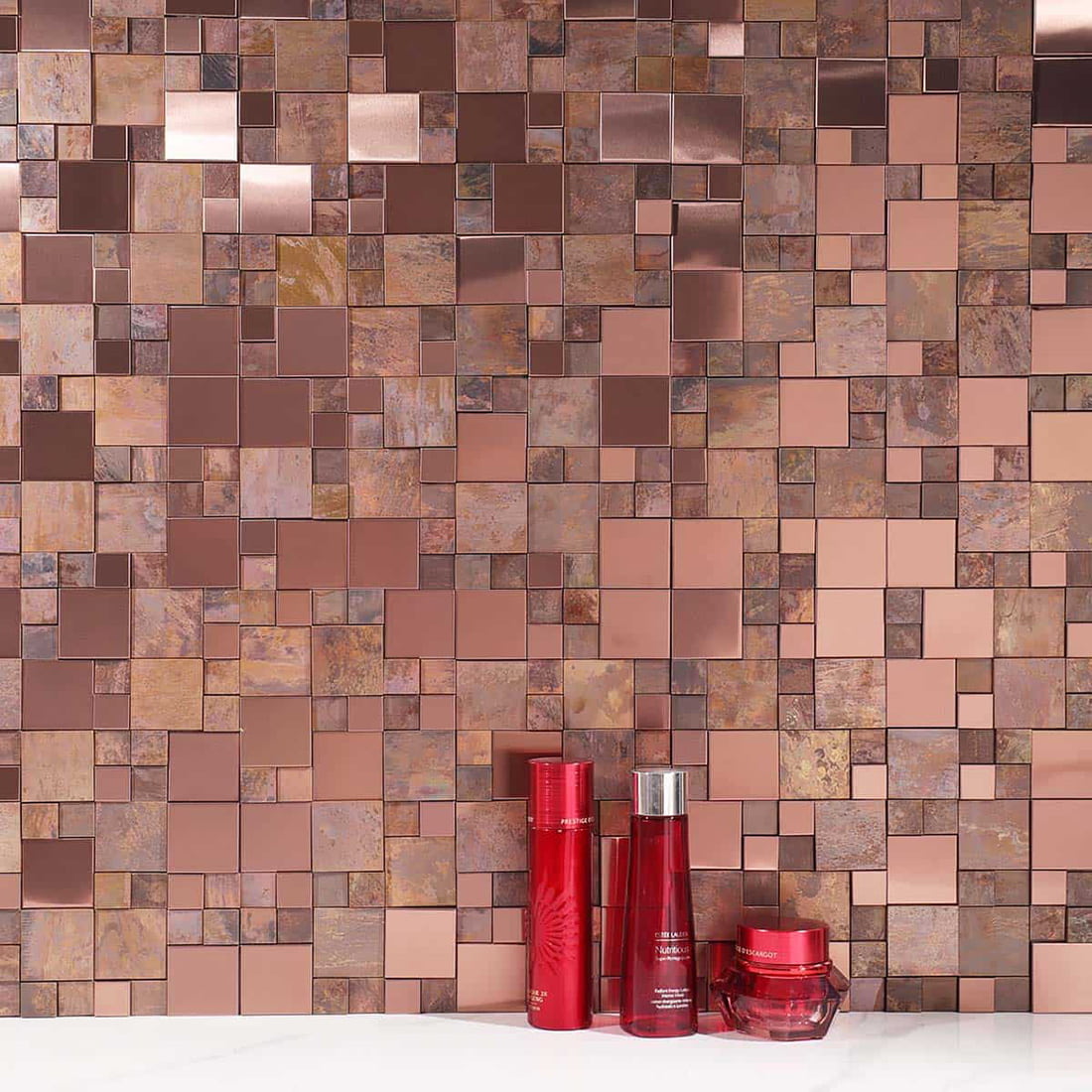 Rose gold and antique copper mosaic wall with red cosmetic decor