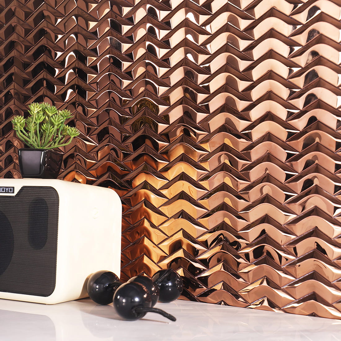 Interior wall scene with rose gold chevron metal mosaic tile