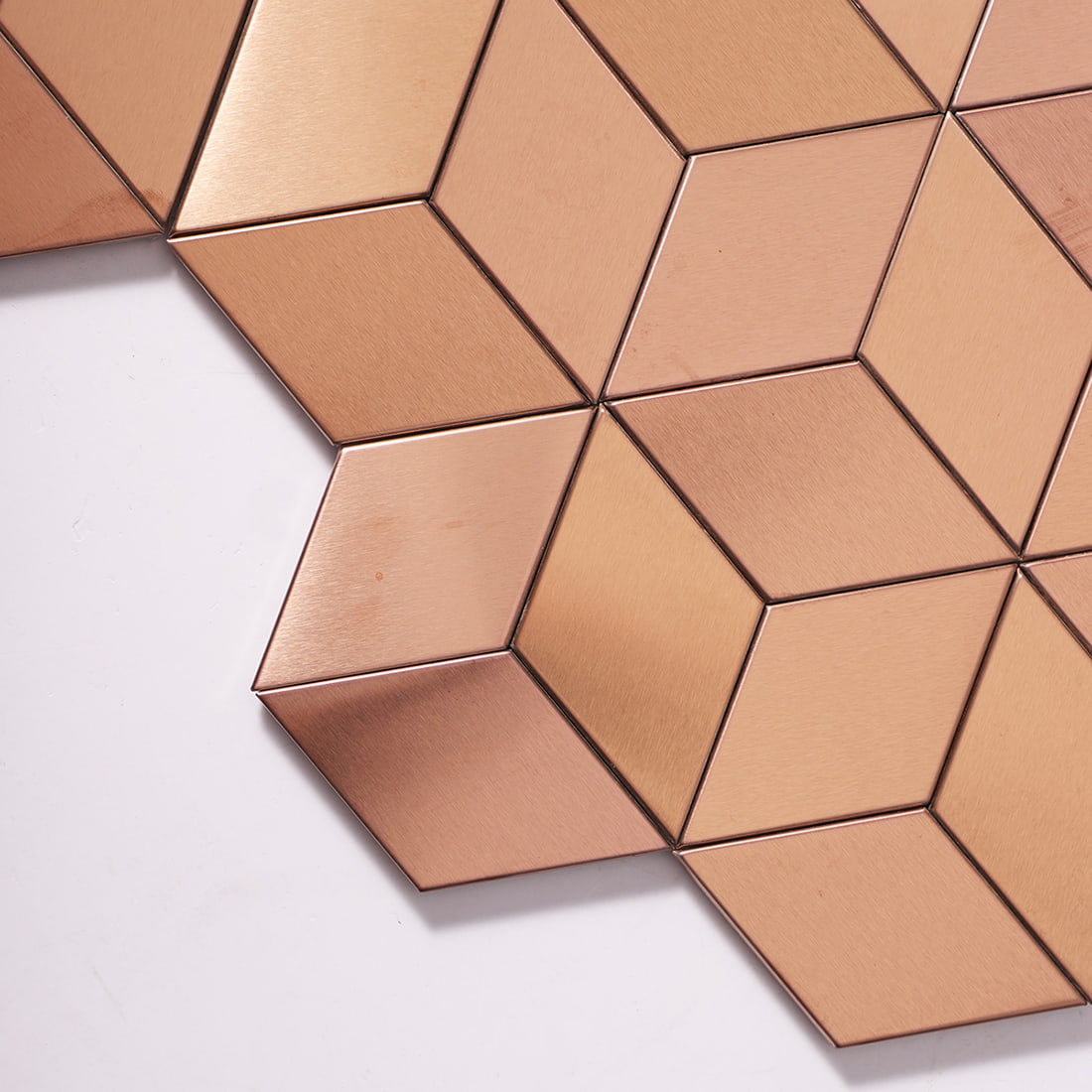 Corner detail of rose gold cube metal mosaic tile surface