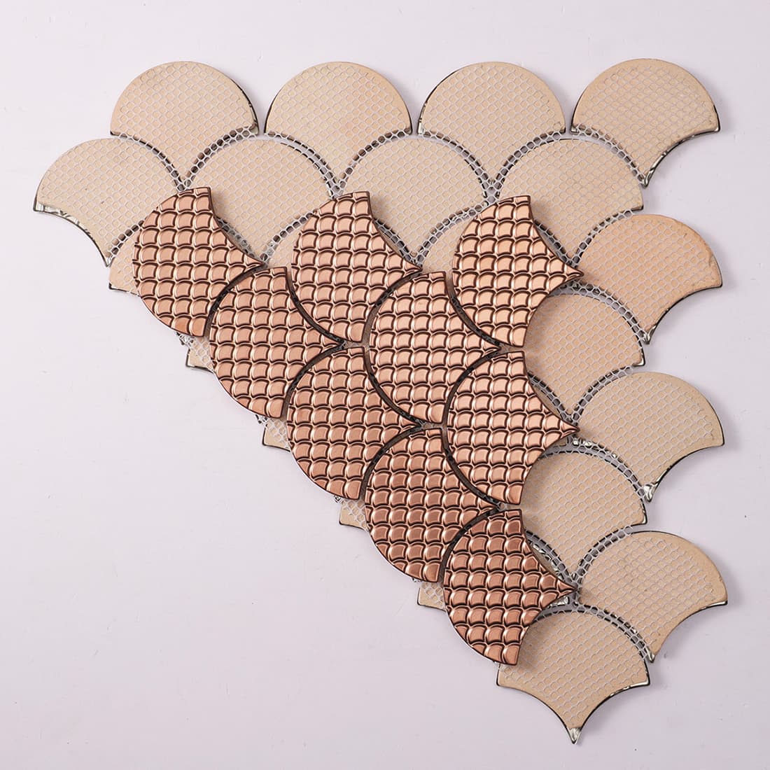 Back view of rose gold fish scale metal mosaic tile with mesh backing