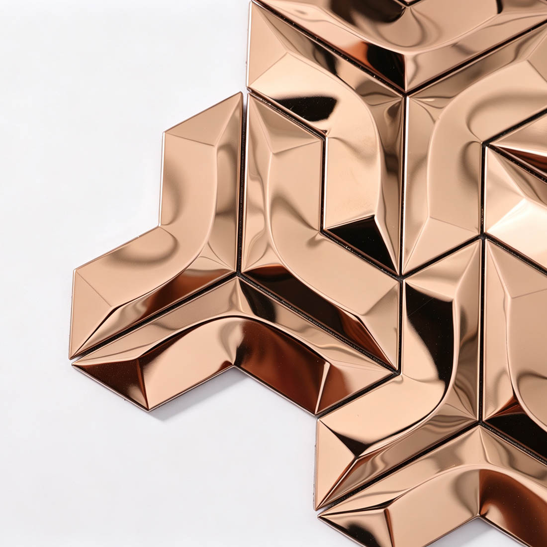 Angled view of rose gold geometric 3D metallic mosaic wall tile