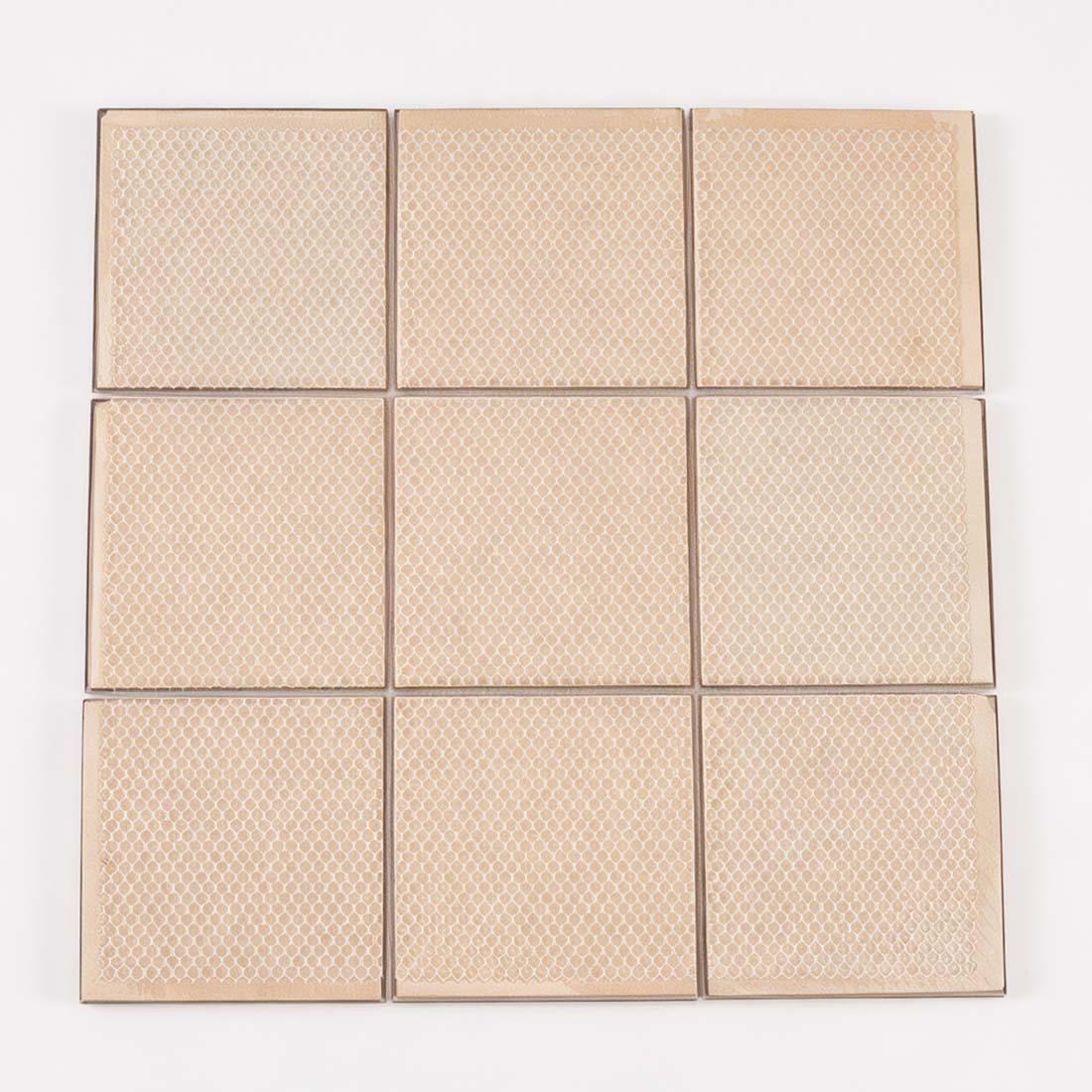Back view of mesh mounted rose gold pyramid square metal mosaic sheet