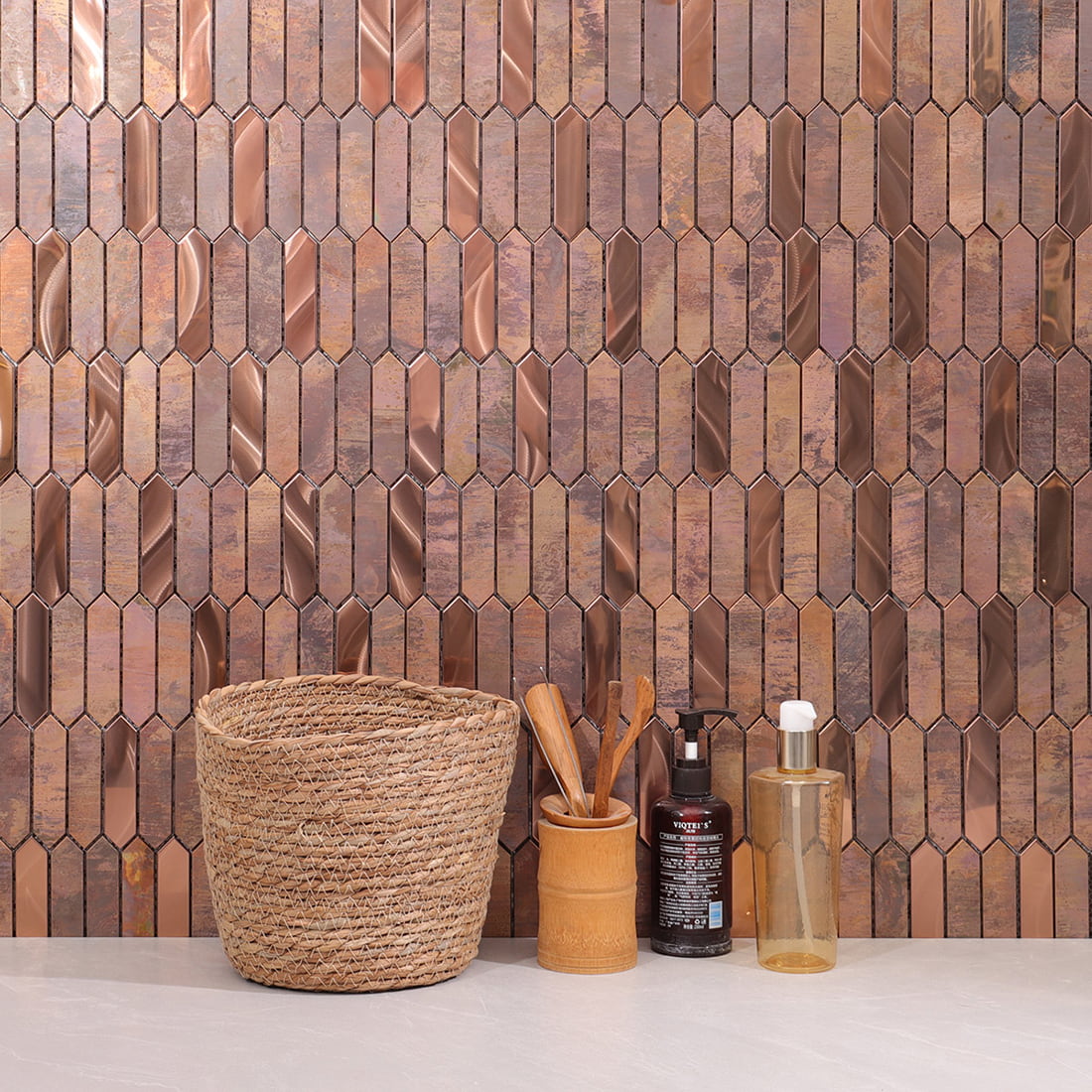 Installed wall view of rose gold and rustic copper elongated hexagon mosaic tile