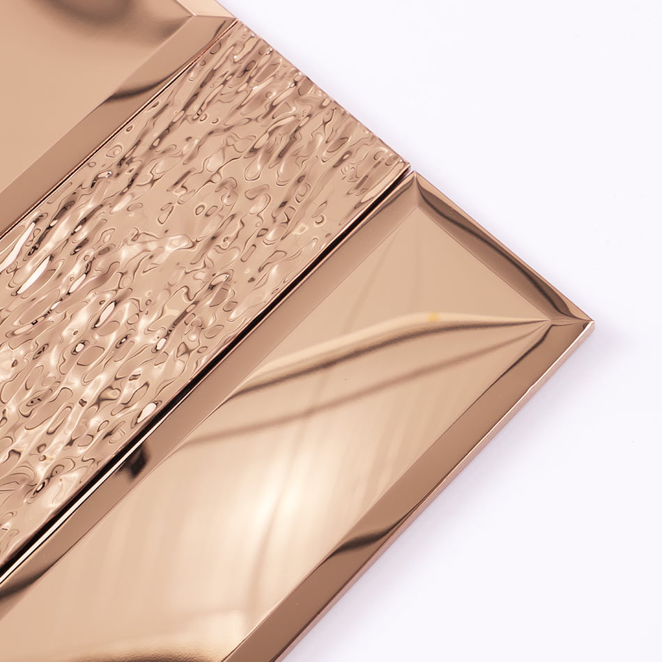 Corner detail of rose gold textured and beveled metal tile