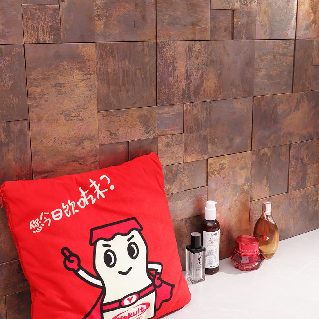 Rustic copper metal mosaic wall tiles styled in a bathroom countertop scene