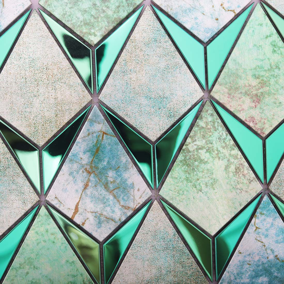 Detail of seafoam green kite mosaic with pale stone textures and metallic accents