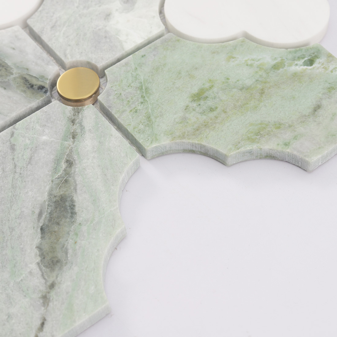 Side detail of green white arabesque marble tile showing stone thickness