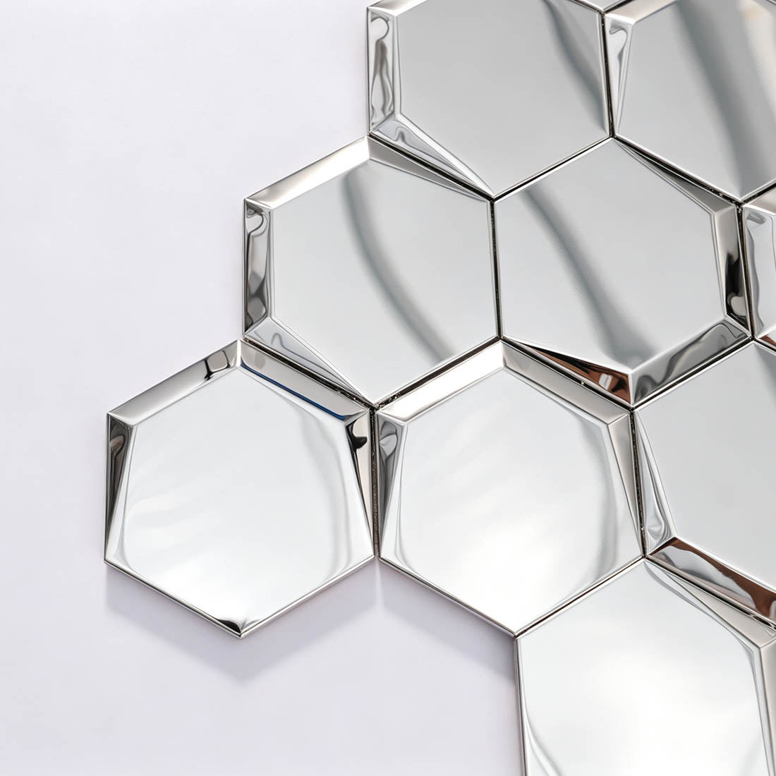 Close-up of silver 3D hexagon stainless steel mosaic tile corner
