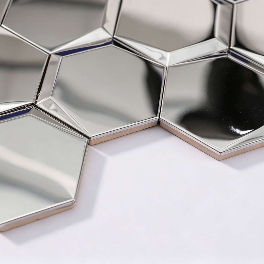 Edge detail of silver 3D hexagon stainless steel mosaic tile sheet