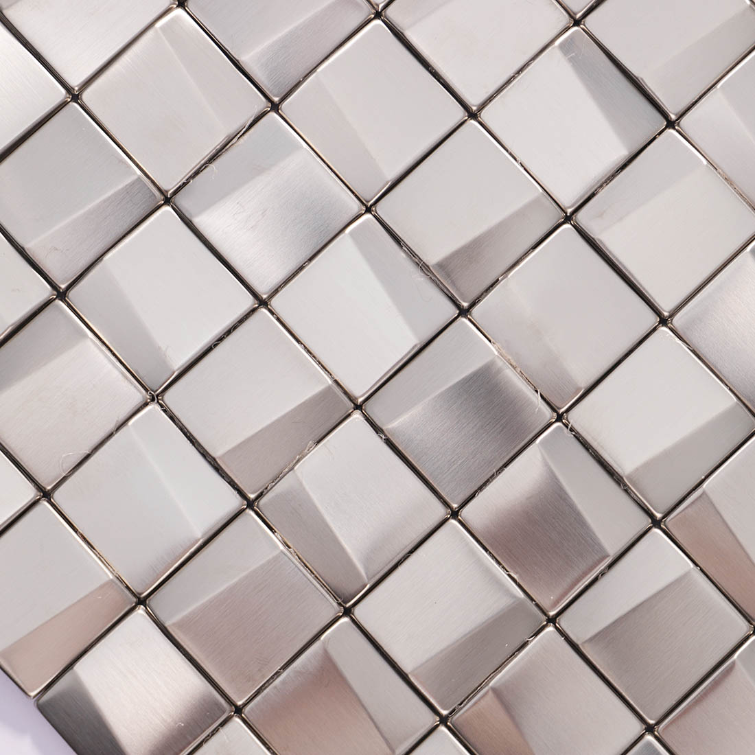 Detailed view of brushed silver 3D square stainless steel mosaic tiles