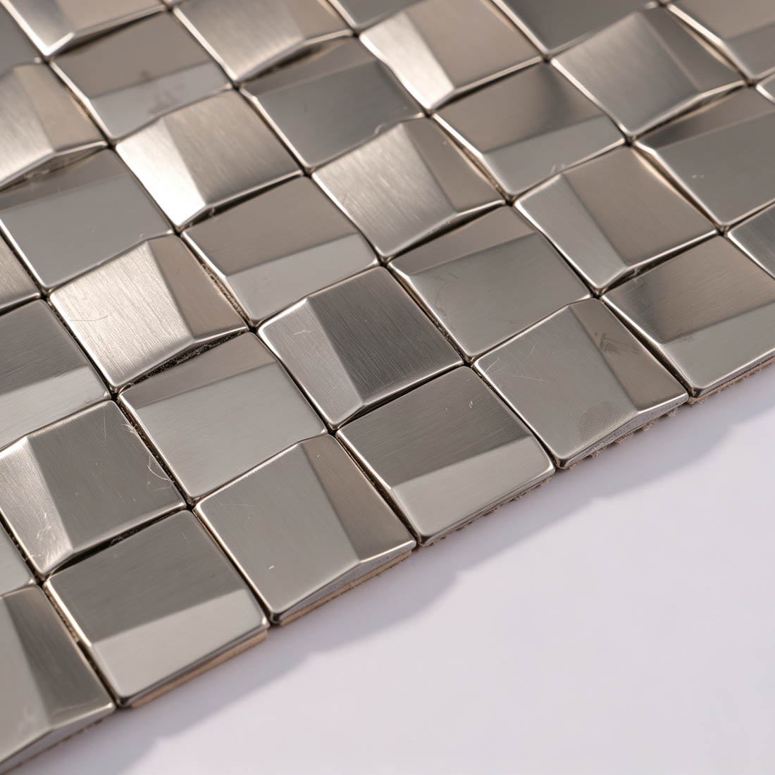 Edge detail of silver 3D square stainless steel mosaic tile sheet
