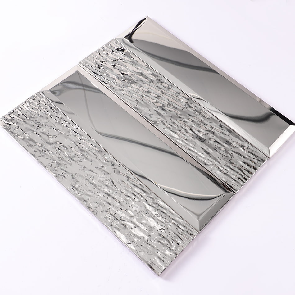 Angled view of silver beveled and textured metal mosaic tile sheet