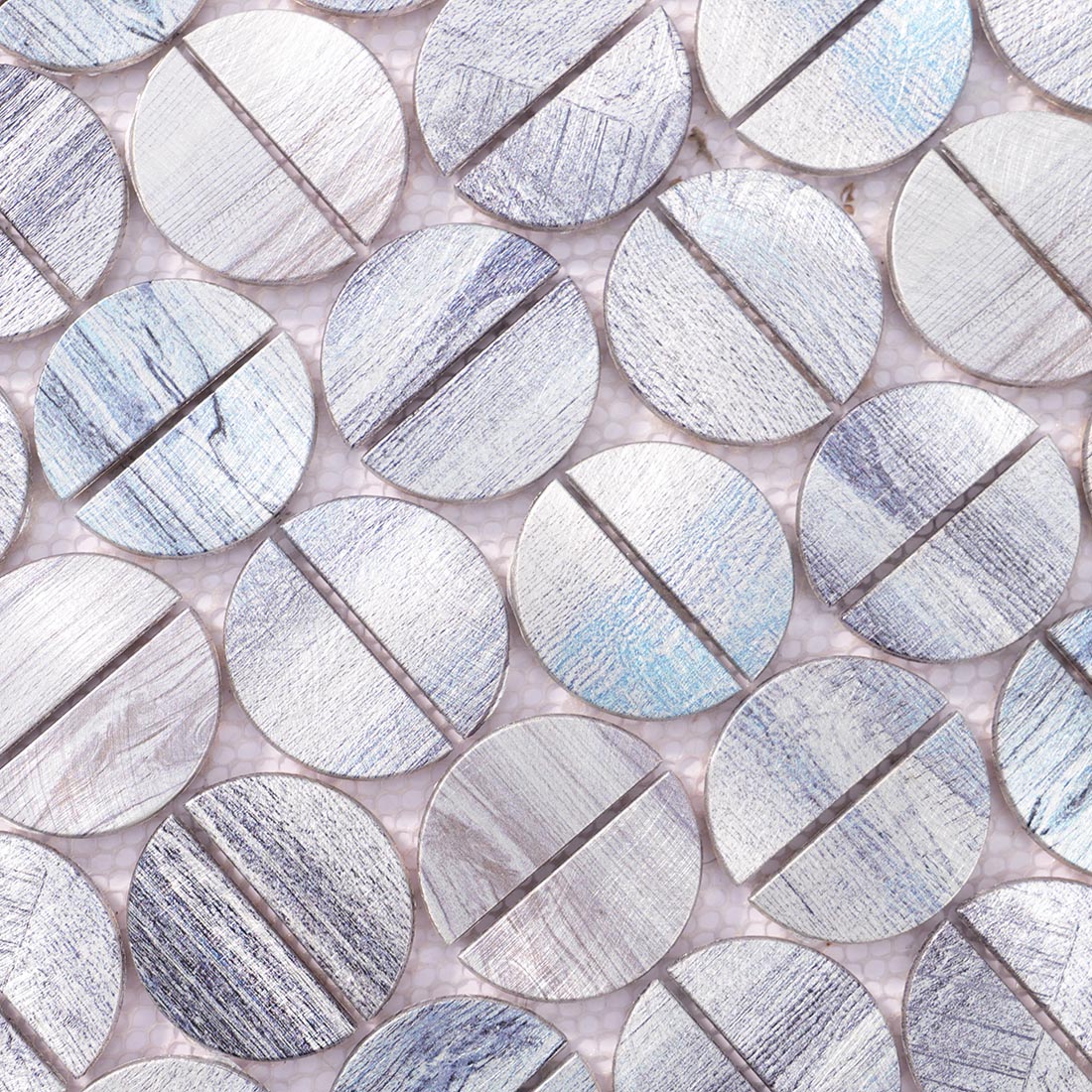 High angle view of silver brushed round aluminum mosaic with blue hints