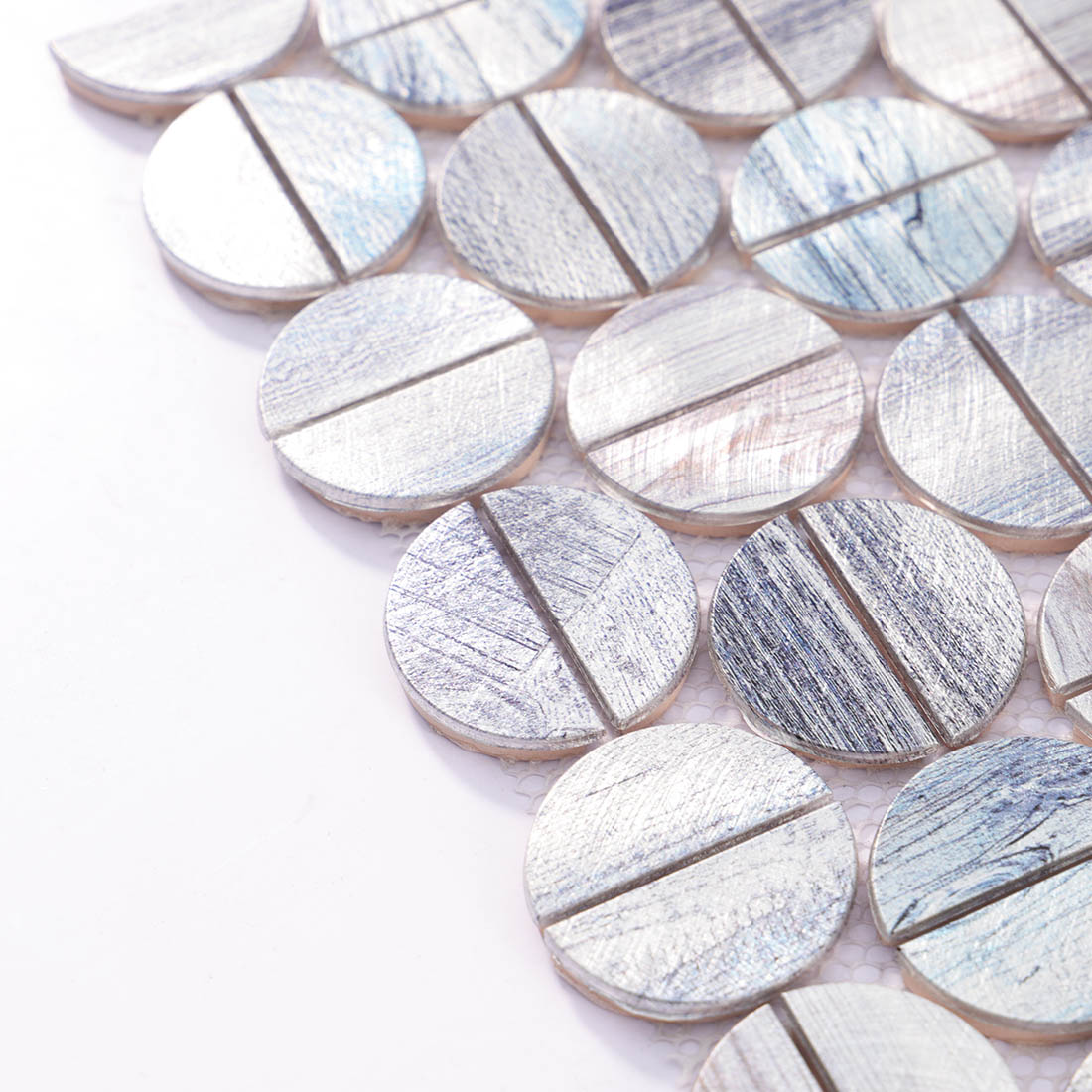 Angle shot of silver blue round mosaic tile showing metallic edge