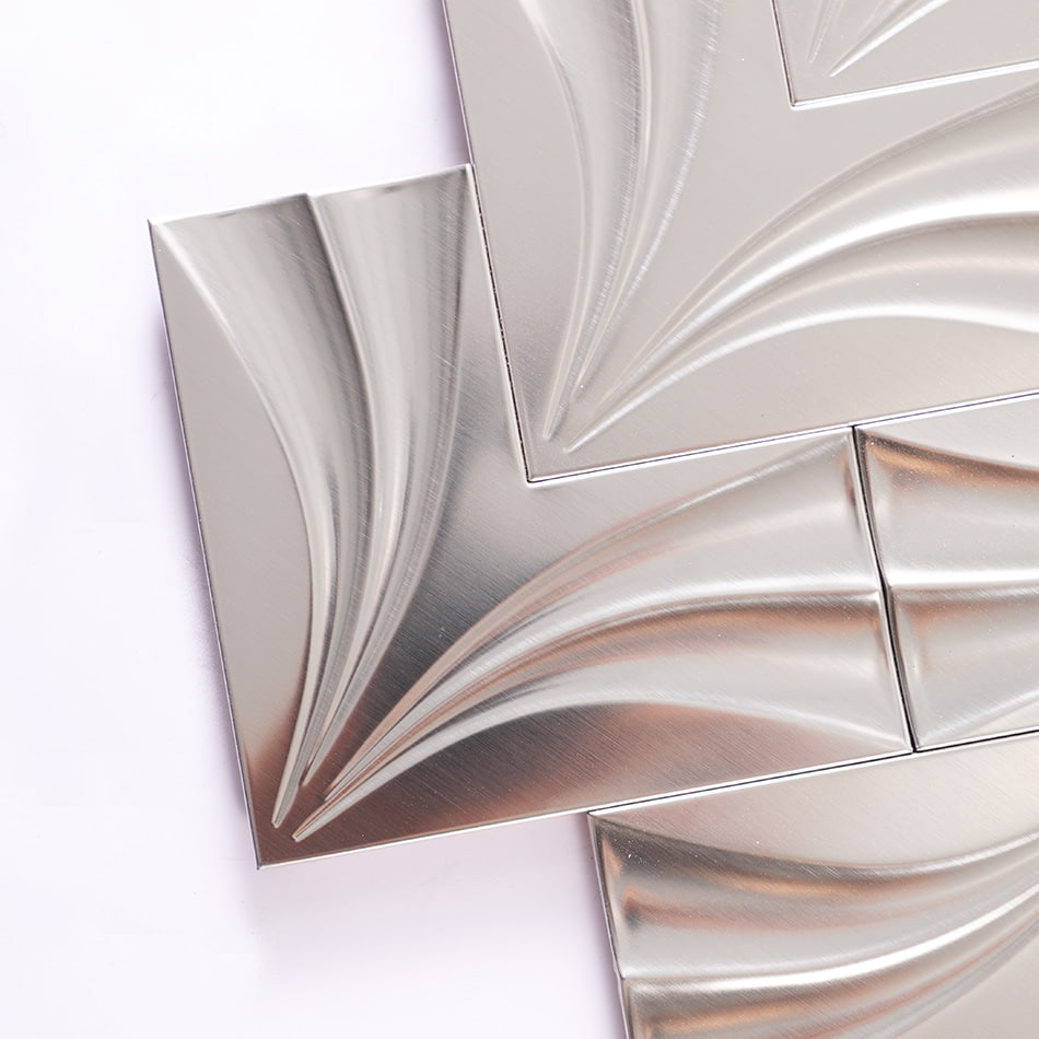 Corner detail of silver chevron stainless steel mosaic tile