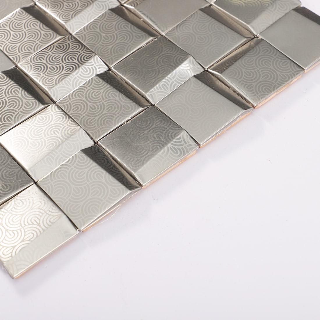 Edge view of silver embossed square metal mosaic tile sheet