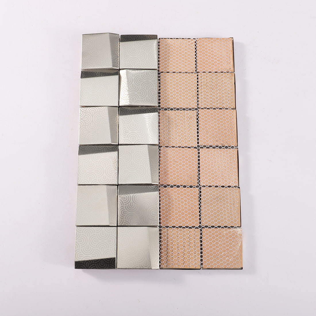 Back view of silver embossed square metal mosaic tile with mesh backing