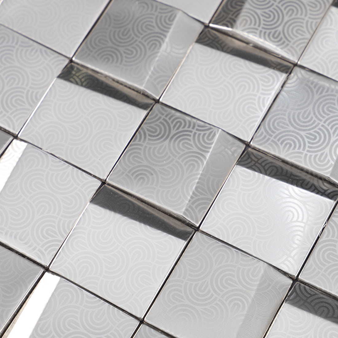 Close-up of silver embossed square metal mosaic tile surface