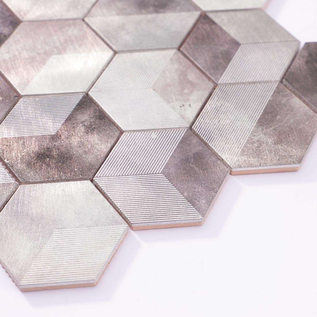 Angle shot of silver grey 3D hexagon mosaic showing metallic edge