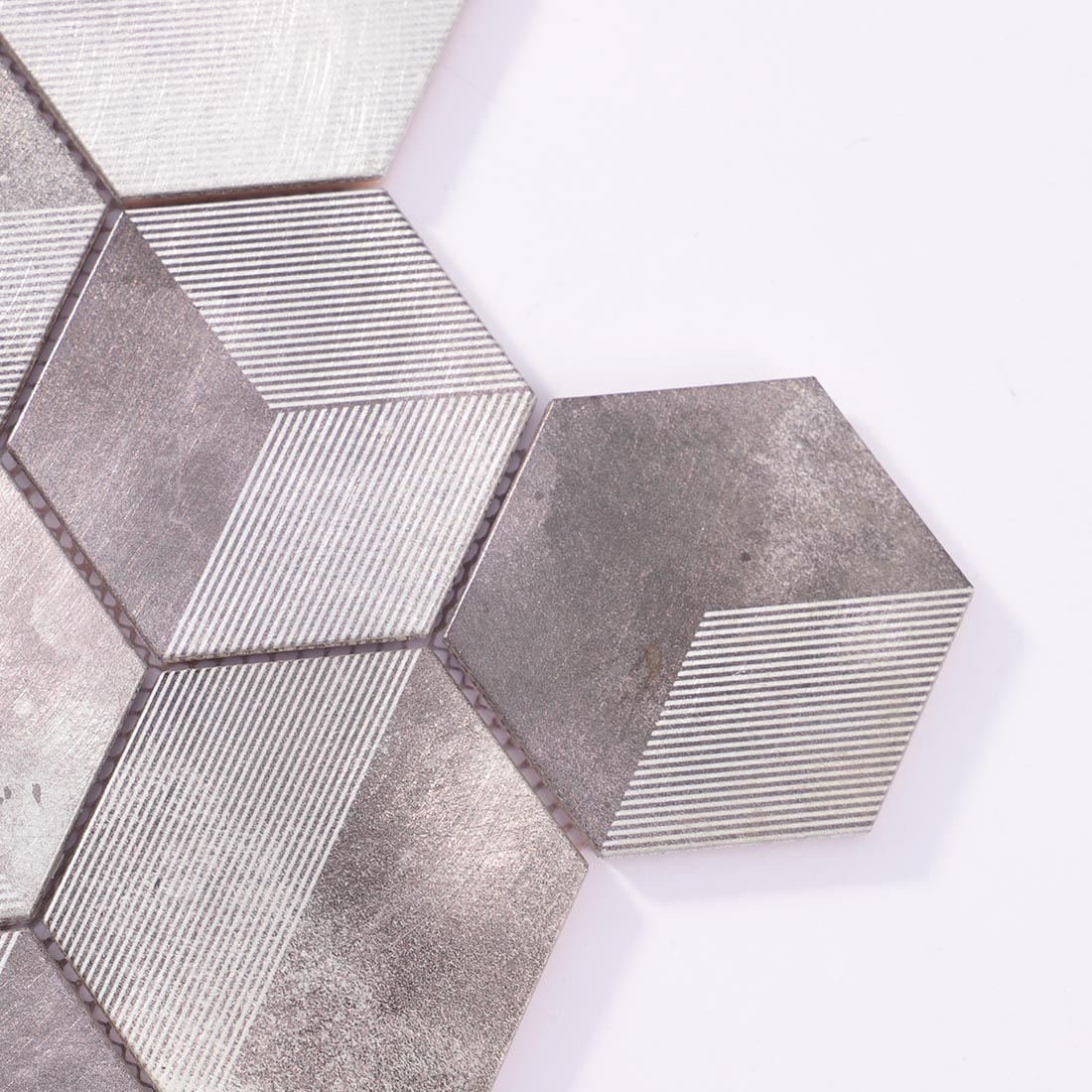 Close-up detail of silver grey 3D cube hexagon aluminum mosaic tile