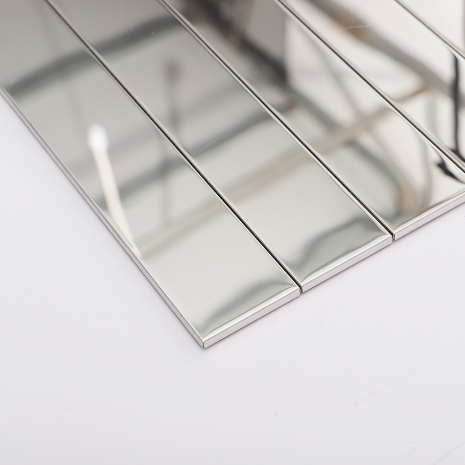Close-up of silver mirror long strip tiles showing polished edges and surface