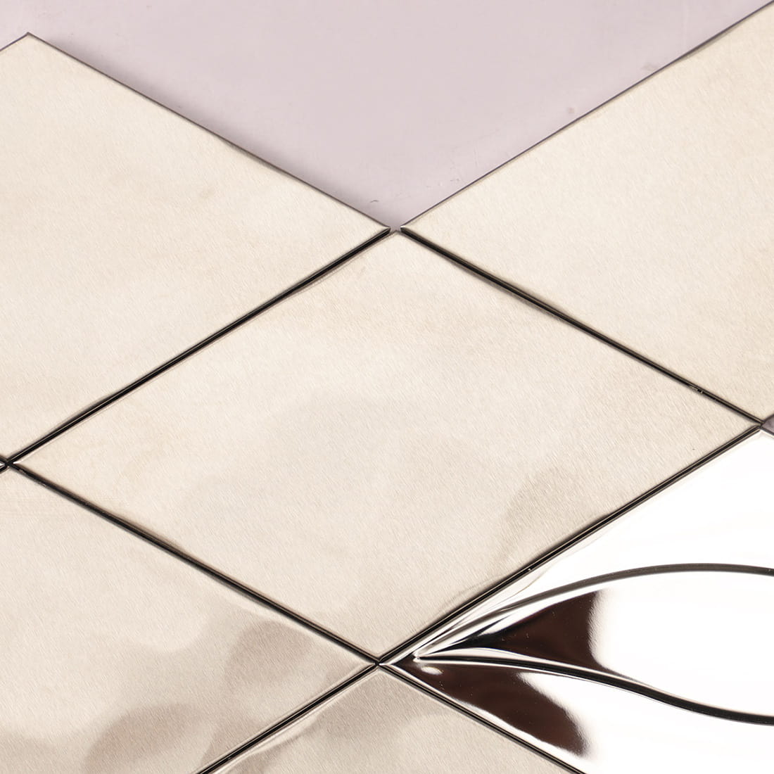 Detail of brushed stainless steel diamond mosaic tiles in silver.
