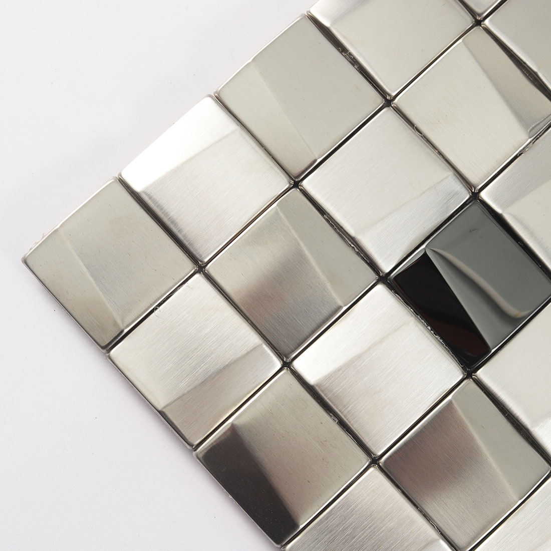 Close up of silver square metal mosaic tile with brushed texture