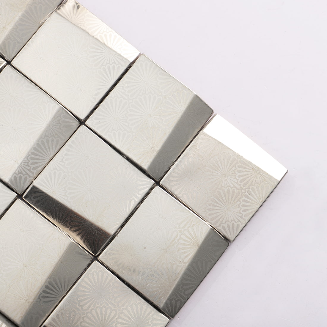 Corner detail of silver stainless steel 3D square mosaic tile