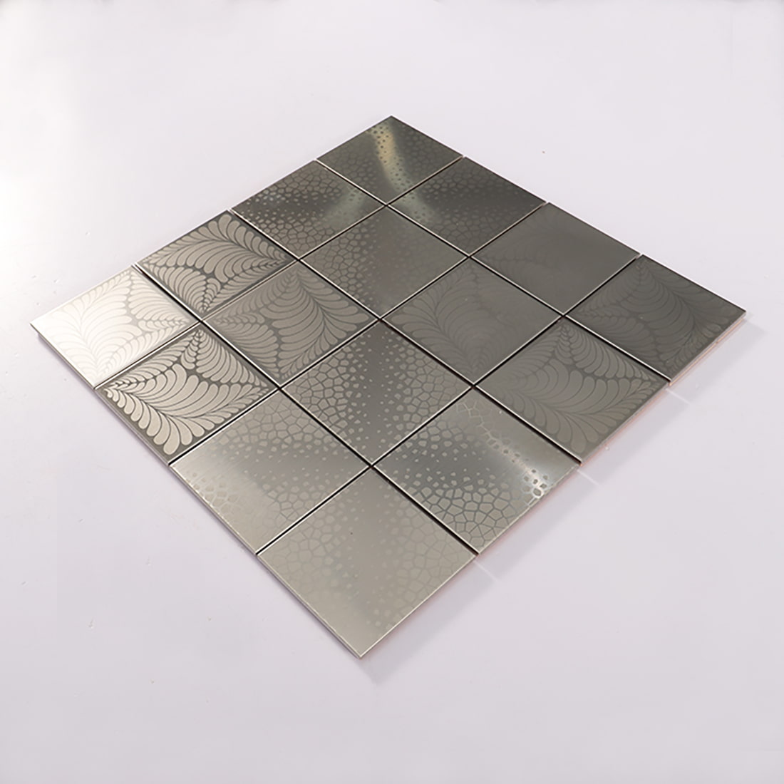 Angled view of decorative silver stainless steel square mosaic sheet
