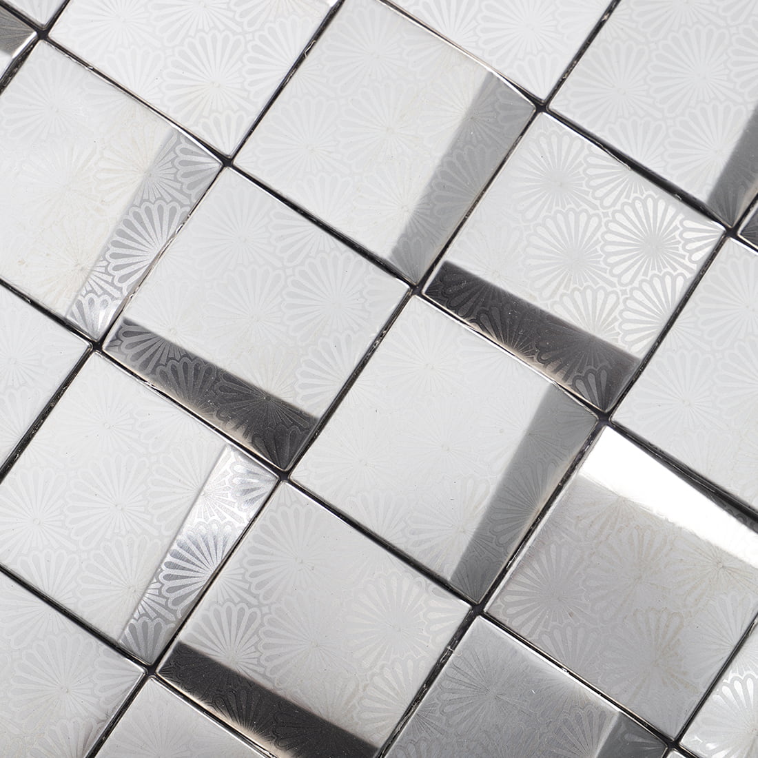 Close up of silver stainless steel embossed square mosaic tile