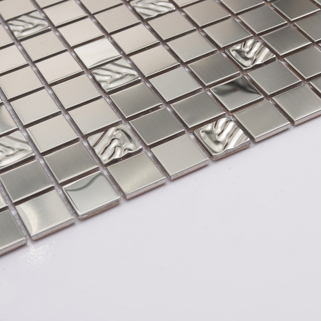 Edge view of silver stainless steel square mosaic tiles with brushed metal surface