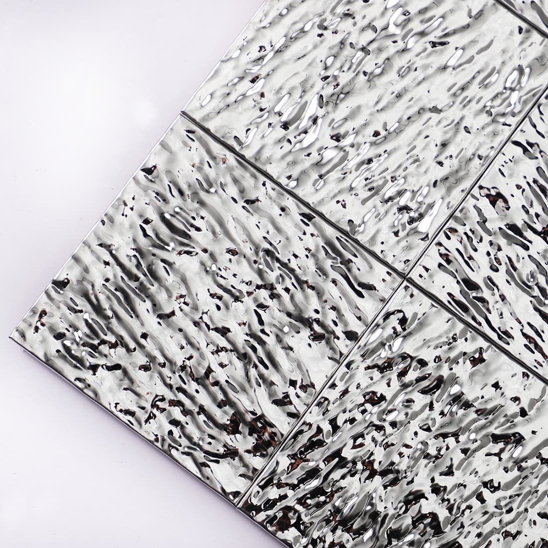 Close-up of silver textured square metal mosaic tile surface