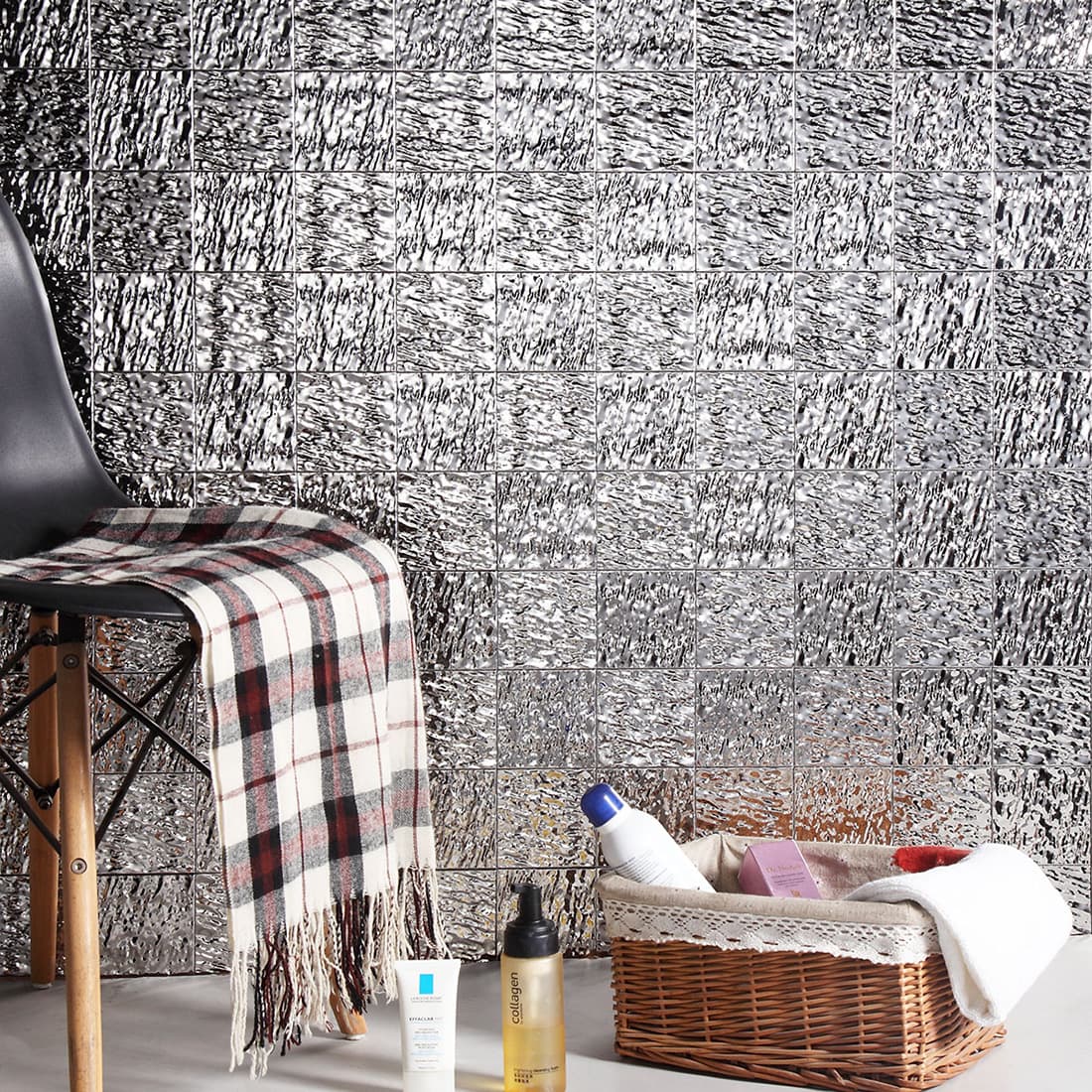 Silver textured square metal mosaic tile wall scene with chair and basket