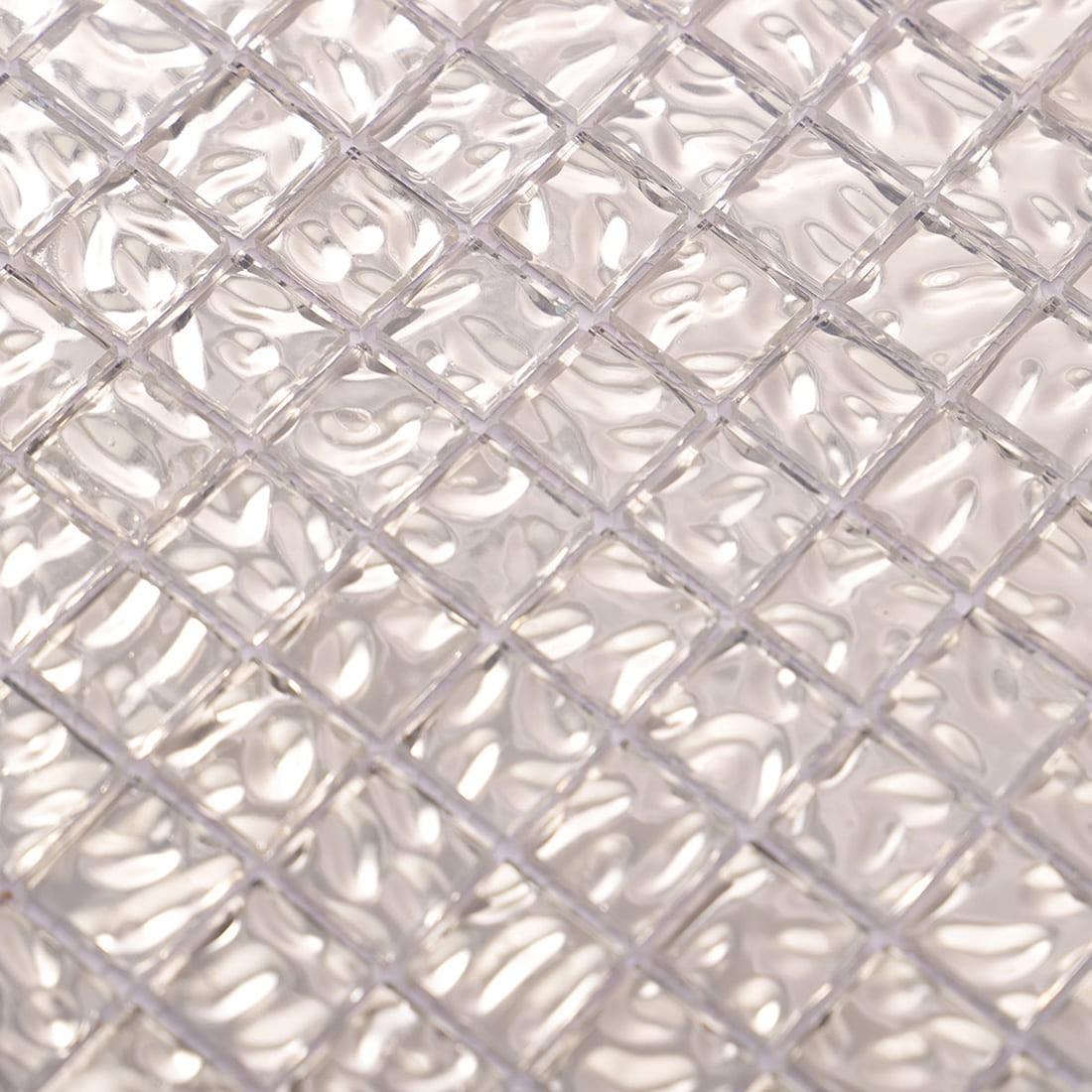 Glossy close-up of silver wavy 20mm square glass mosaic tile