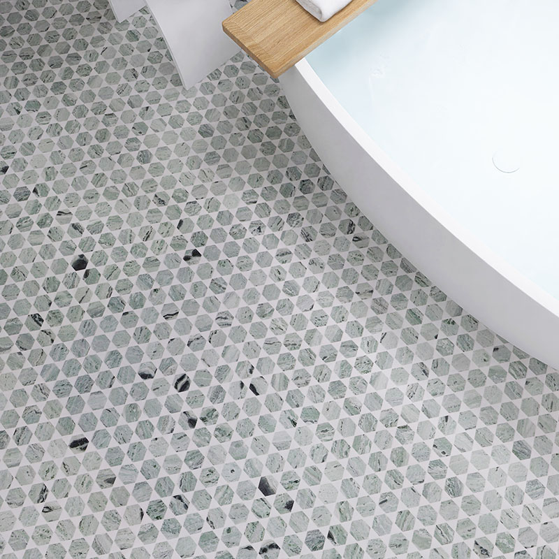 Small green and white marble hexagon mosaic floor tile in a modern bathroom