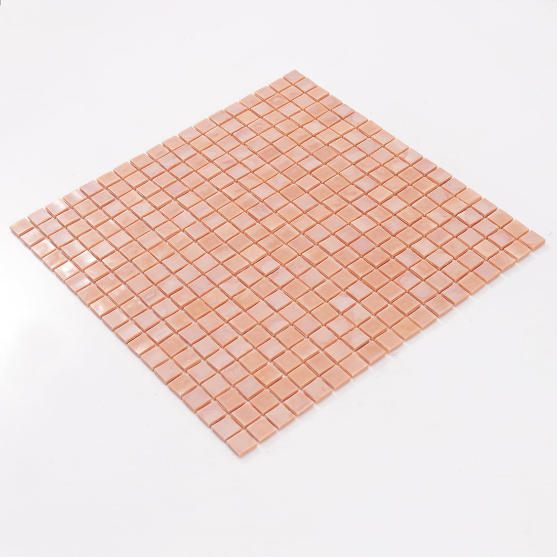 Angled view of soft pink square glass mosaic tile sheet
