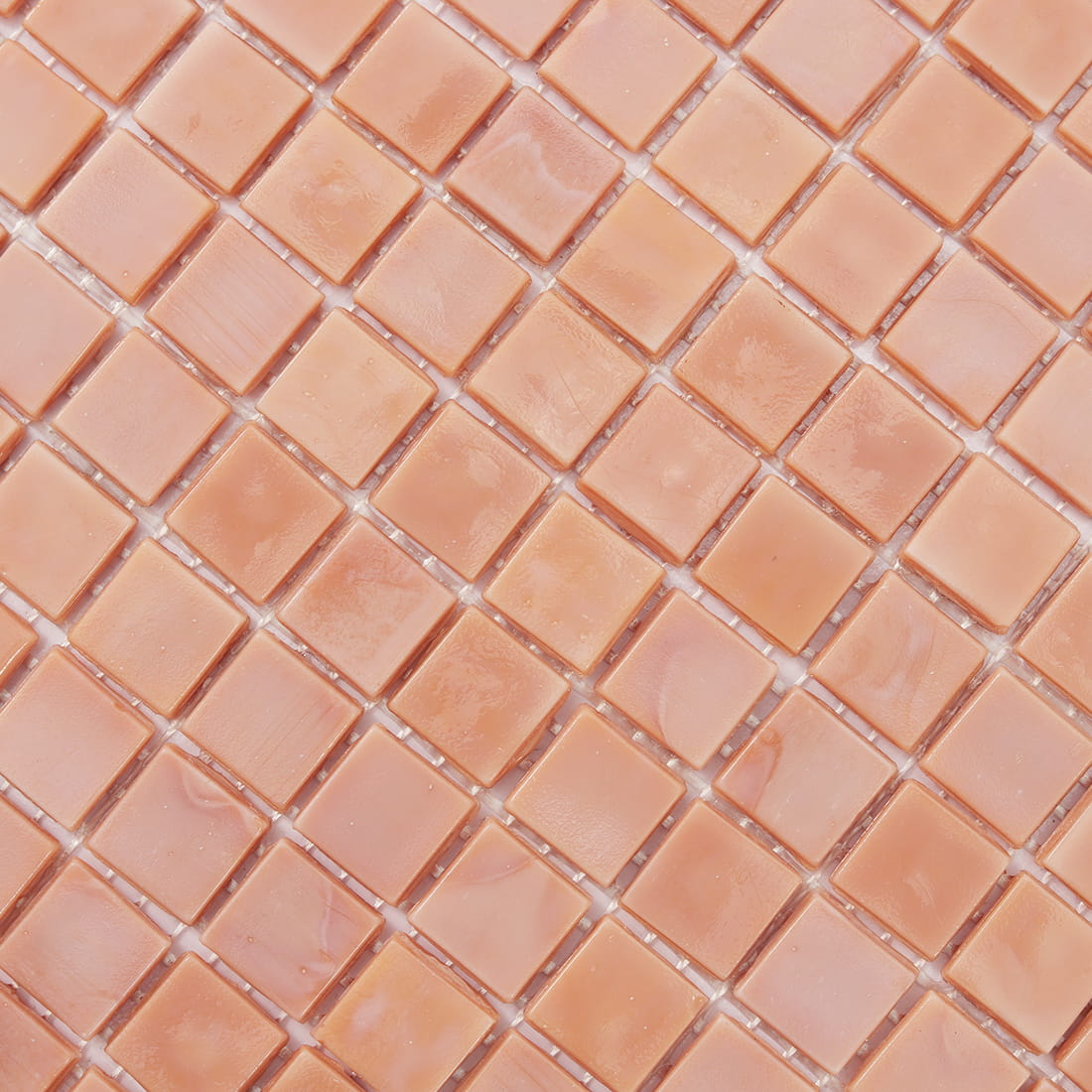 Close-up of soft pink square glass mosaic tile surface