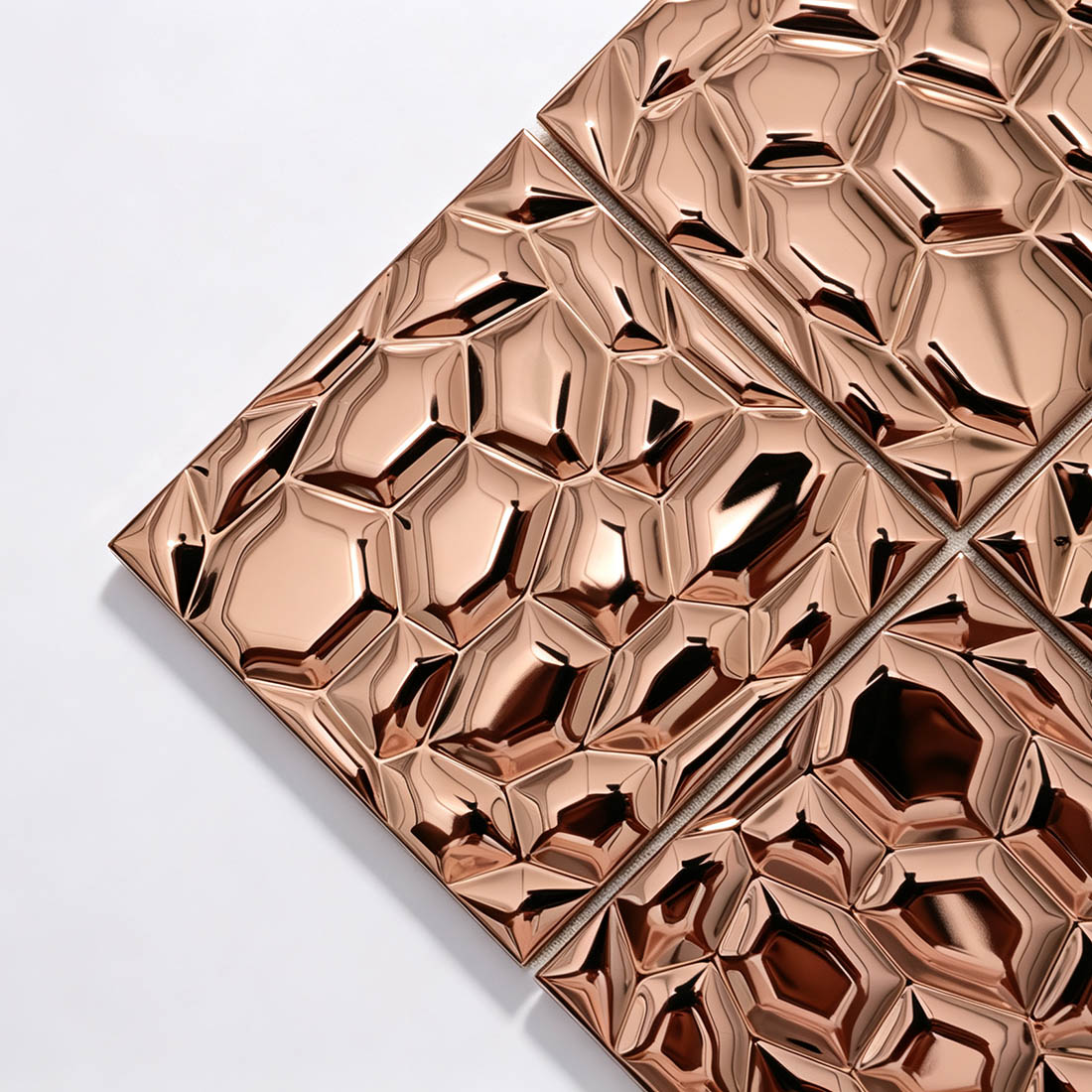 Angled view of rose gold square 3D metallic mosaic wall tile