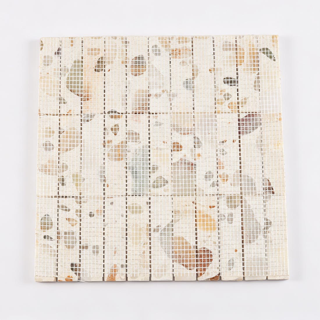 Professional mesh-mounted backing of terrazzo and stone composite mosaic.