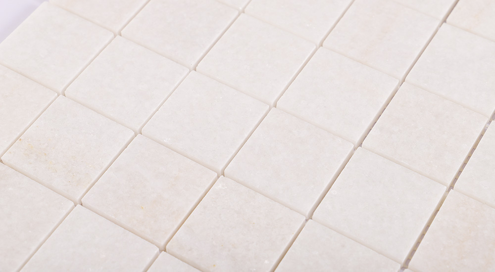 {"default":"Polished Thassos Marble Tiles in square shapes, ideal for luxury kitchen and bath backsplashes."}
