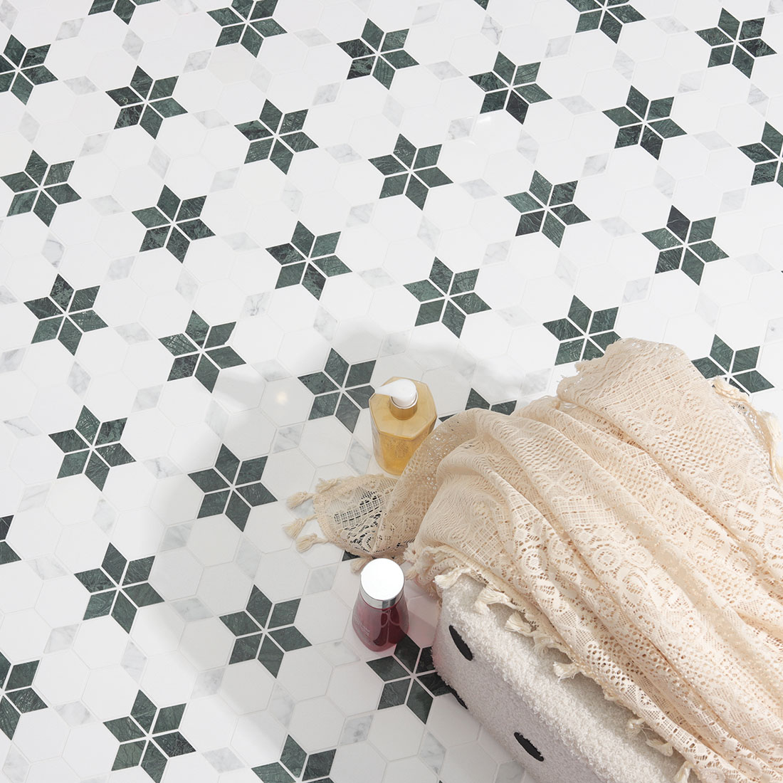 A high-angle, top-down photograph of the geometric marble mosaic floor.
