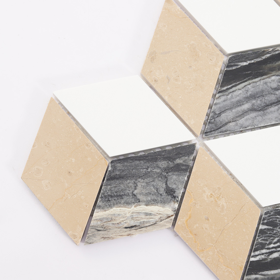 Close-up of the edge of 3D cube tricolor marble mosaic.