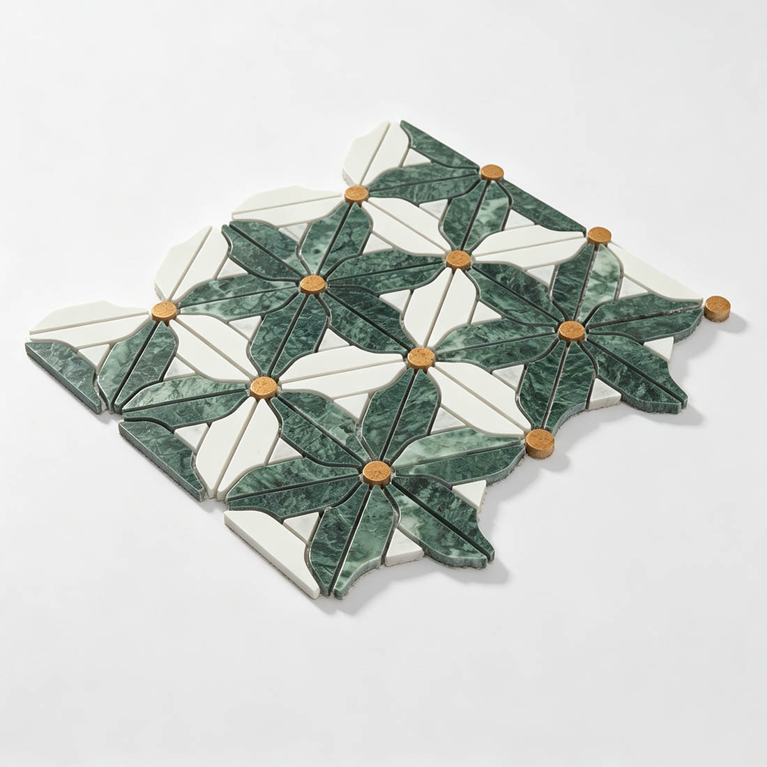 Angled display of Verde Guatemala green and ivory botanical marble mosaic tile