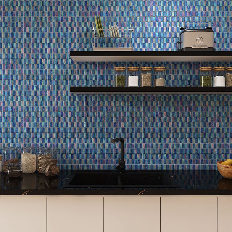 Blue iridescent kit kat vertical kitchen tiles on modern backsplash.