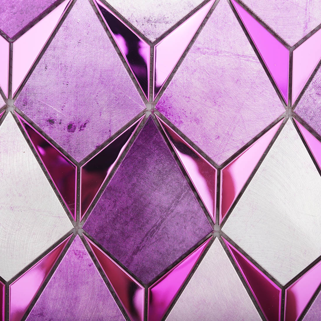 Detail of violet purple and brushed silver kite metal mosaic with glossy accents