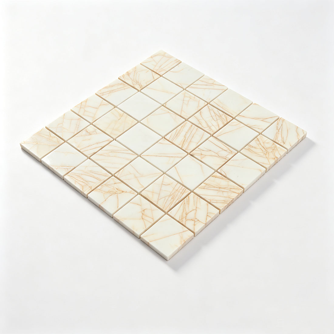 Angled sheet view of warm white square marble mosaic tiles