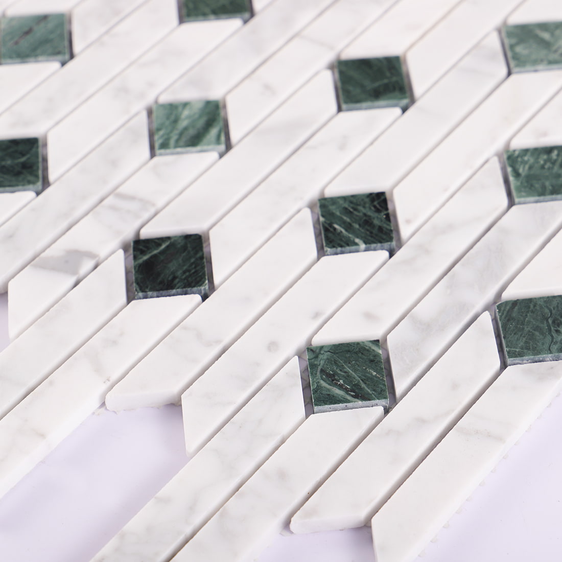 Edge detail of white and green marble linear mosaic tile